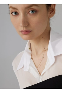 Elegant gold titanium steel necklace featuring tiny colorful gemstones on a delicate chain