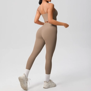 Detail view of high-waist yoga leggings with lift design and mocha brown sports bra set
