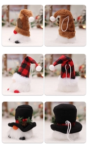 Detail of plush Christmas gnome ornaments with hanging loops and festive hat styles