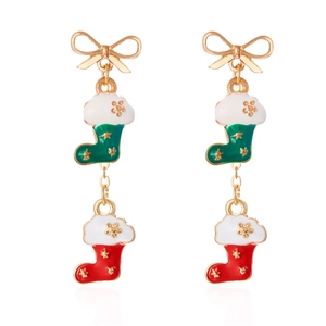Detail of Christmas drop earrings with gold bow and colorful enamel holiday stocking charms