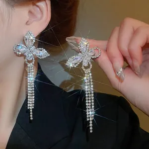 Elegant silver butterfly tassel earrings with sparkling white cubic zirconia crystals