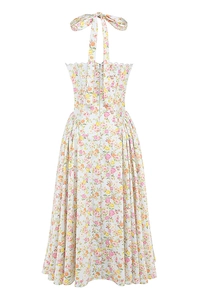 Detail view of the halter neck tie and vibrant floral print on the summer maxi dress