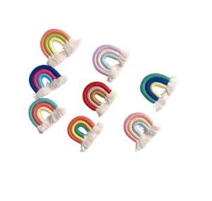 Detailed view of colorful handmade woven rainbow tassels with fringe for DIY accessories