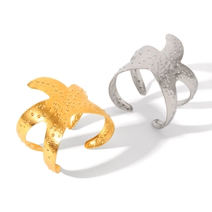 Starfish open bangles in gold and silver stainless steel with hammered texture finish