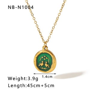 Detail of vintage gold necklace with green enamel bird pendant and product dimensions