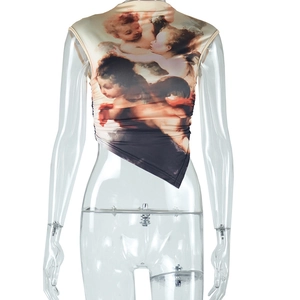 Detail of crop top featuring vintage angel print and asymmetrical hemline design
