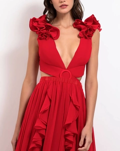 Detail of red deep V-neck swimsuit featuring 3D floral ruffles and waist cut-out accents