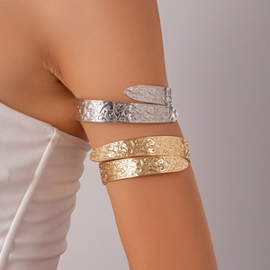Set of gold and silver open arm cuffs with intricate vintage floral hollow engraving