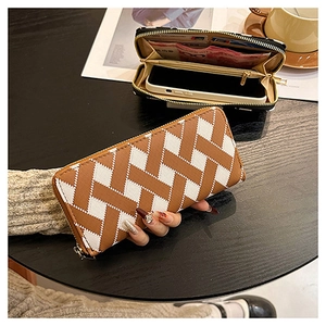 Detail of cross-pattern long wallet showing multiple card slots and smartphone storage