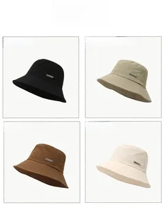 Selection of four colors for the quick-dry bucket hat with branded metal tag
