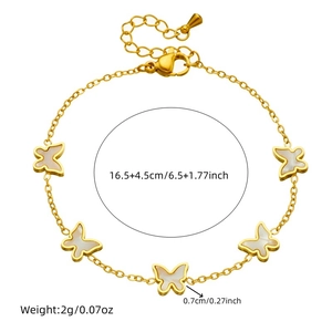 Golden butterfly charm bracelet with white shell inlays and adjustable chain length
