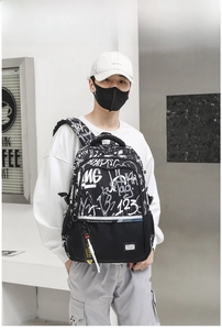Street style black and white graffiti backpack with to explore the future slogan and reflective strip