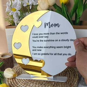 Close-up of Mother's Day acrylic gift plaque with gold mirror moon and heart cutouts