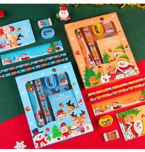 Close-up of 6-piece Christmas stationery set with Santa and reindeer motifs