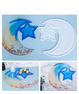Star and moon resin tray silicone mold showing finished blue tray with gold foil details