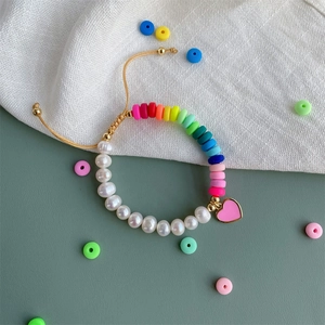 Rainbow heishi beads and freshwater pearl bracelet with pink heart enamel charm
