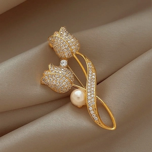 Elegant gold tulip brooch with sparkling crystal pave and a classic round white pearl