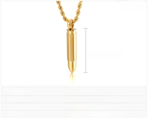 Macro detail of gold bullet pendant showing 36x6mm dimensions and stainless steel texture