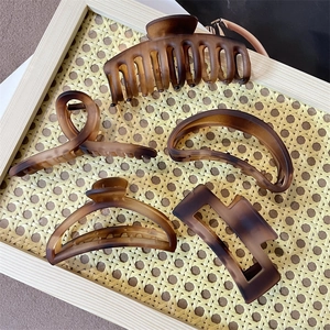 Set of 5 large matte amber brown hair claws in various geometric shapes and resin designs