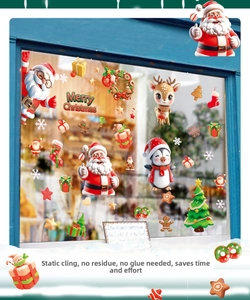 Detail of 3D Santa and reindeer static window stickers on a glass door for Christmas decor