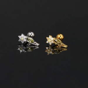 Flower and leaf zircon piercing earrings in gold and silver steel on black background