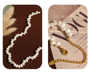 Macro shot of natural pearls and gold lobster clasp on a vintage necklace