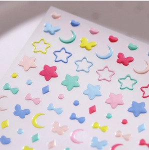 Detailed view of 3D embossed heart and star nail stickers with macaron pastel colors