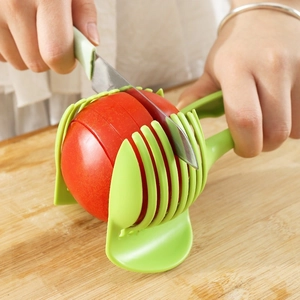 Green plastic multi-functional fruit slicer guide for even tomato and lemon slicing