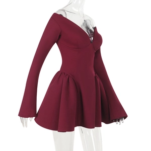 Detailed side view of a wine red long-sleeve dress with V-neck and flared skirt
