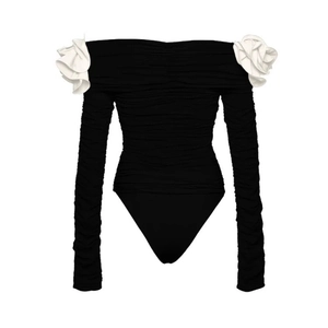 Black and white long sleeve bodysuit with 3D floral accents and ruched texture
