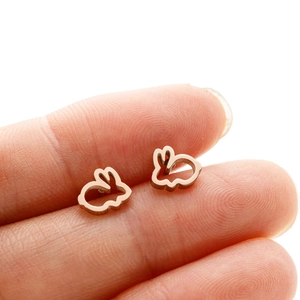 Detailed close-up of rose gold hollow rabbit earrings showing delicate minimalist design