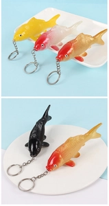 Detailed macro view of PVC koi fish keychains showing textured scales and vibrant colors