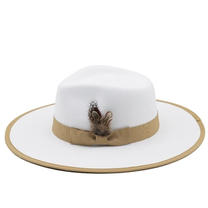 White flat top wool fedora hat with khaki ribbon bow and feather decoration