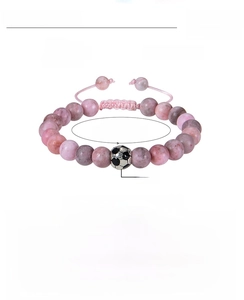 Dettaglio bracciale in pietra zebra rosa 8mm con perla calcio e cordino intrecciato