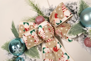 Detail of flocked Christmas wreath with blue snowflake balls and linen gnome print bow
