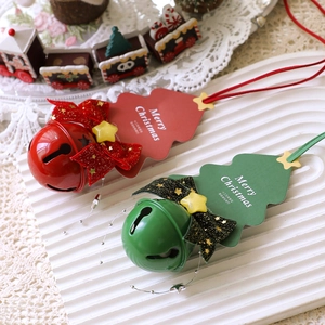 Christmas tree ornaments set with red and green tags, bows, glitter stars, and festive bells