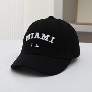 Detail view of black cotton baseball cap featuring 3D white Miami embroidery letters