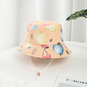 Kids orange bucket hat with cartoon fruit patterns and adjustable white chin strap