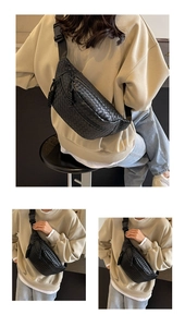 Detail of black woven texture leather chest bag with adjustable strap and buckle