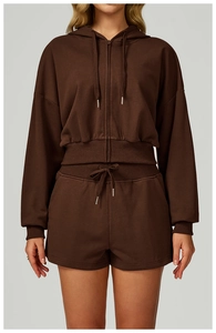 Detail of dark brown zip-up cropped hoodie and drawstring shorts set for women