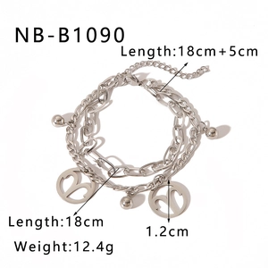 Double-layered stainless steel Aries zodiac bracelet with heart and ball charms detail
