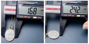 Digital caliper showing the 16.8mm by 24.2mm size of the oval virgin mary shell pendant