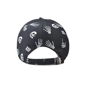 Detailed back view of a black baseball cap with white skull print and metal buckle
