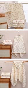 Detail of soft cotton gauze hooded baby towel with cute animal ears and bear prints