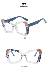 Detail view of butterfly frames with blue floral patterns and solid blue temples