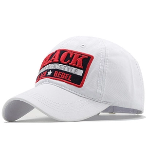 Detail shot of white cotton baseball cap featuring BLACK REBEL embroidery and stiff curved brim