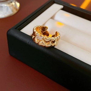 Detail shot of an 18k gold plated heart open ring with micro-pave crystals on a jewelry box