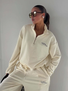 Women's cream fleece two-piece set with half-zip sweatshirt and matching joggers