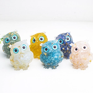 Set of six colorful owl figurines made of resin and crystal with gold foil flakes