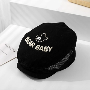 Close-up of Bear Baby embroidery and breathable black mesh fabric on kids sun hat